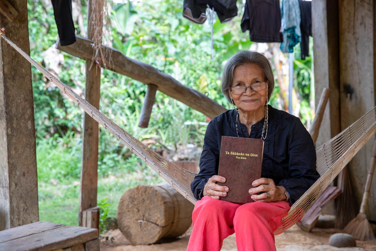 Smiling woman displaying her Bible